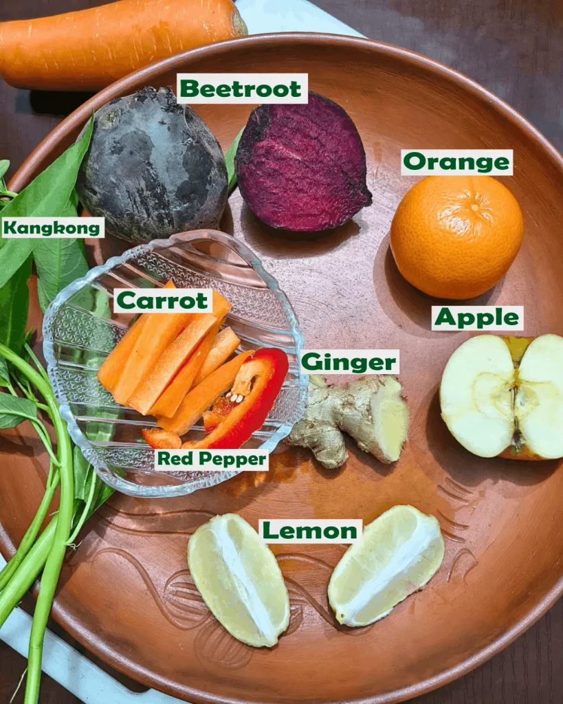 Beet ginger juice ingredients grouped on a cutting board
