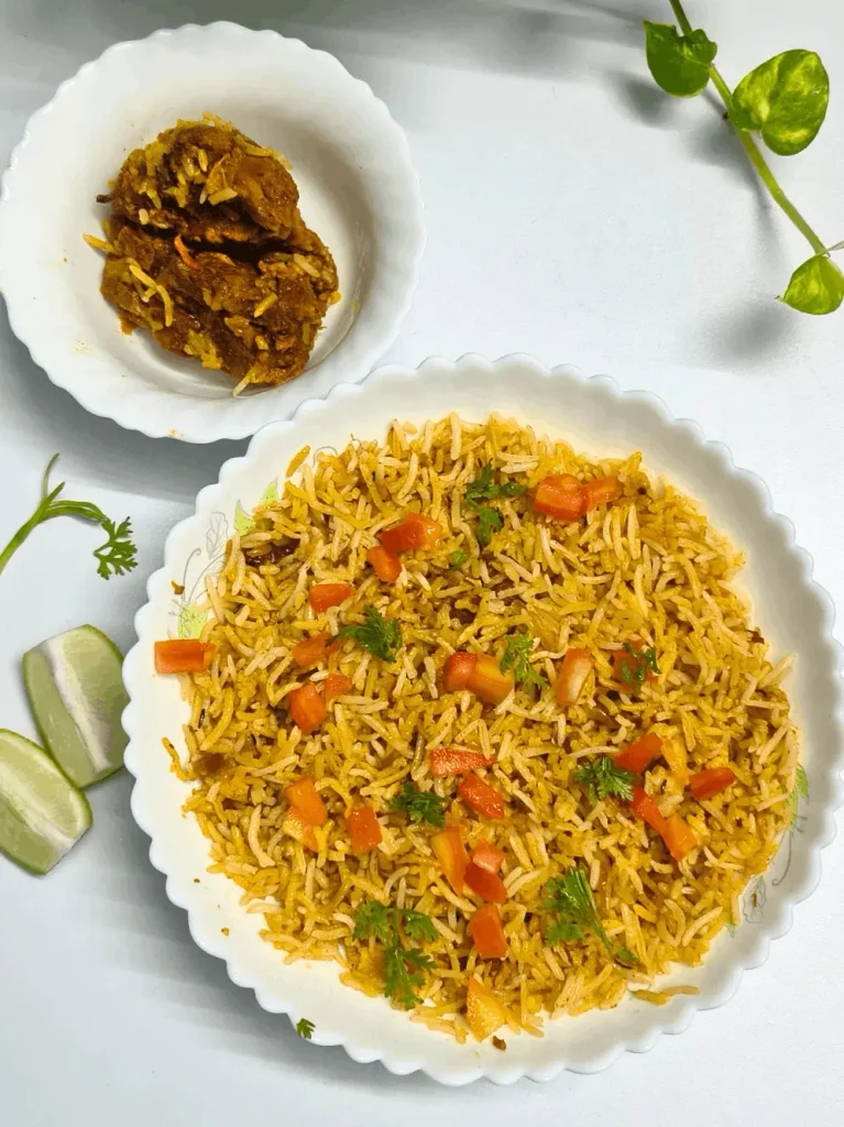 Overhead shot of Cava Saffron Basmati Rice served with meat side and lime