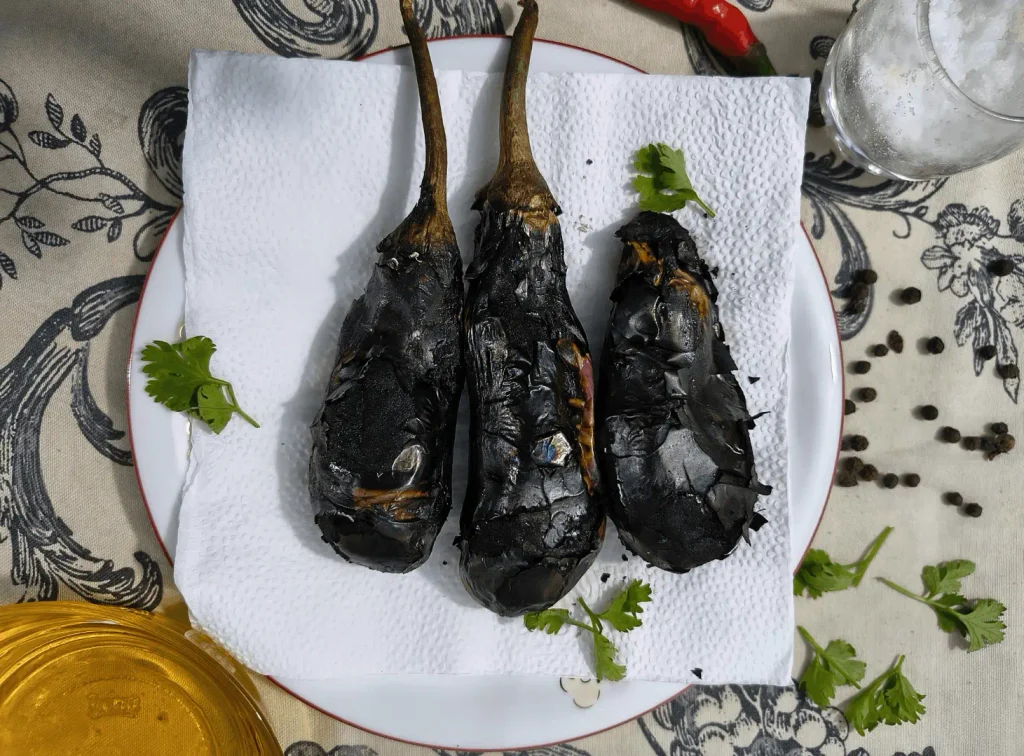 Gas-Roasted Eggplants Cooling Before Peeling for Eggplant Dip